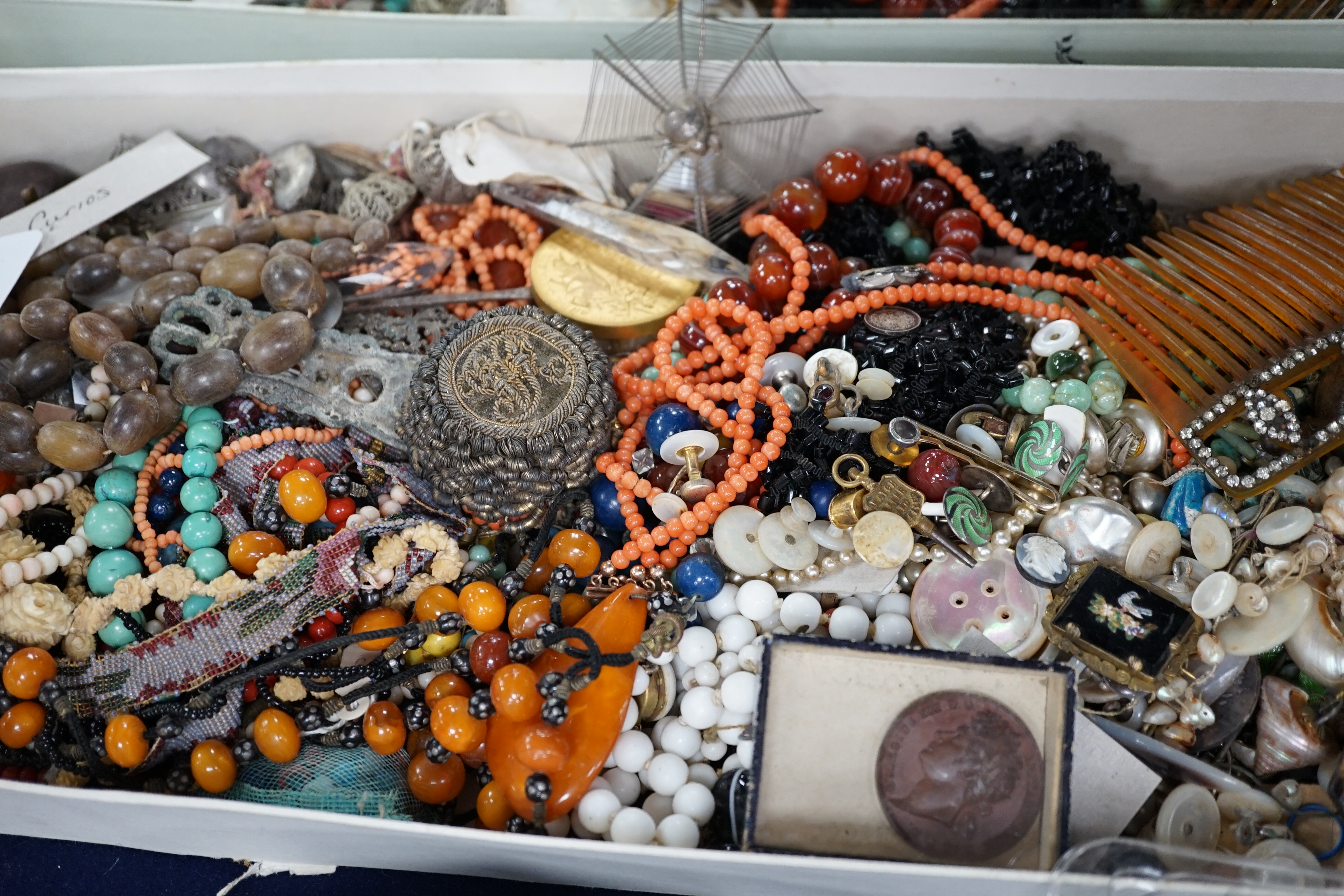 A mixed quantity of assorted jewellery and other items including carnelian agate, coral and amber necklaces, hair ornament, shells, spectacles, etc. Condition - poor to fair